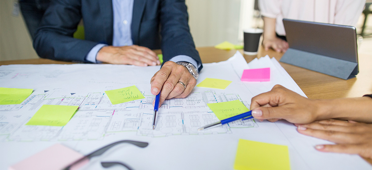 A group of project mangers planning an architectural project